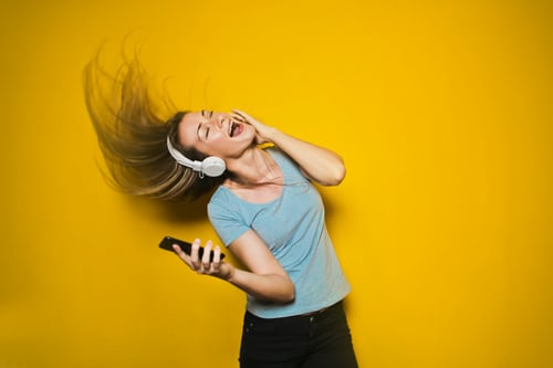 lady rocken out on head phones